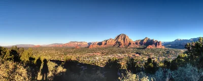 desert valley with red rock formations at sunset